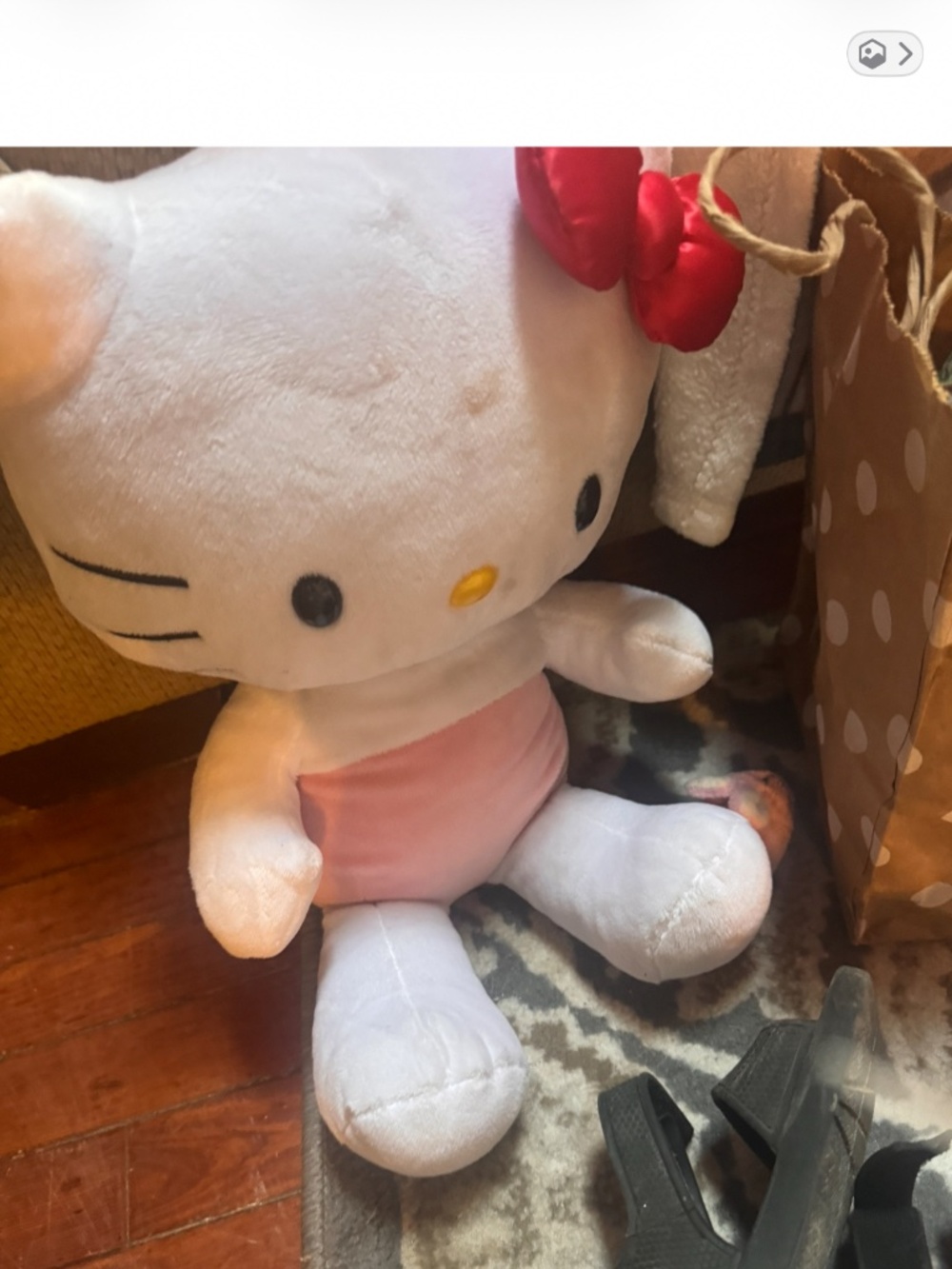 Soft Hello Kitty plush featuring a pink outfit and matching bow. Gentle, cuddly